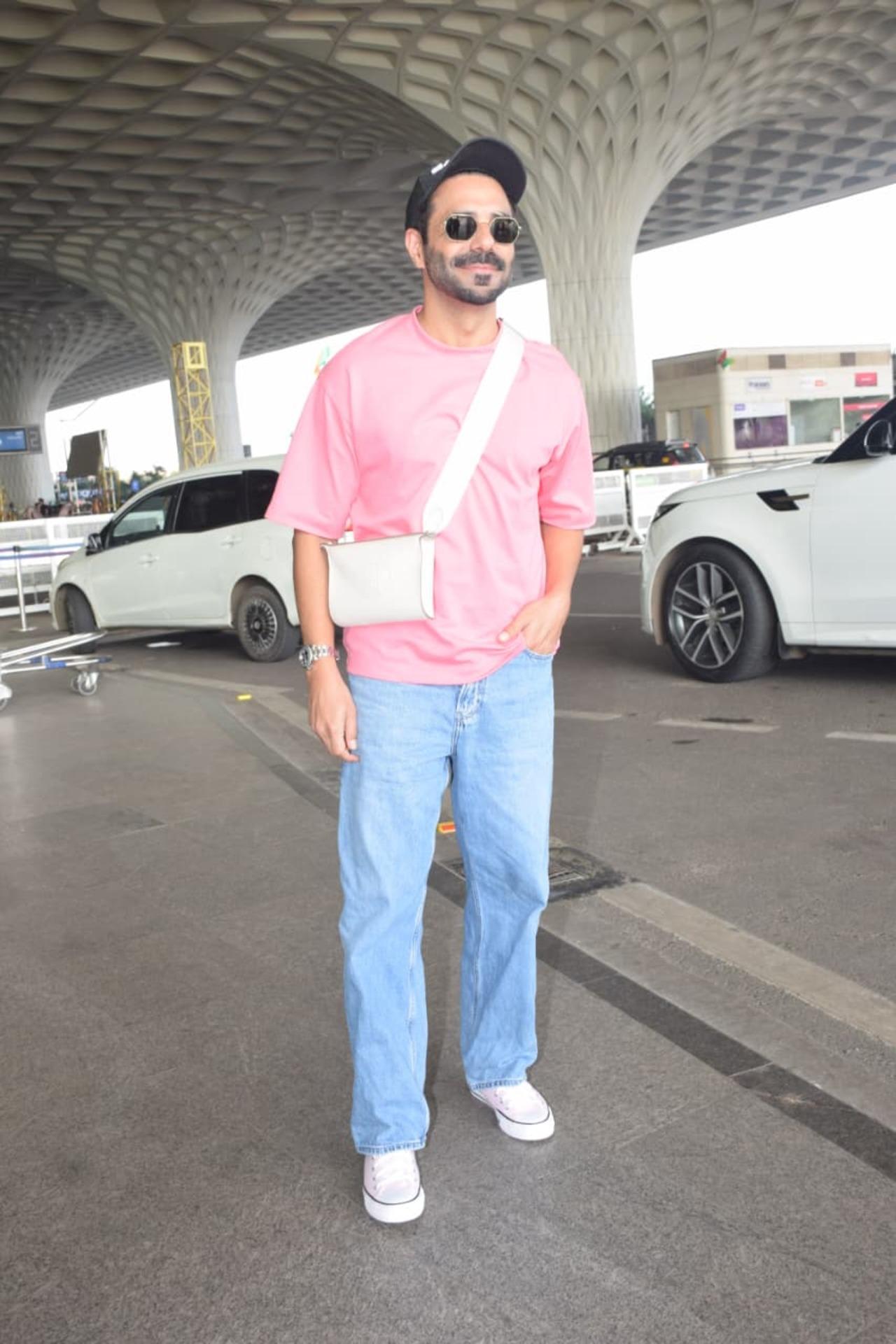 Aparshakti Khurrana was also spotted at the airport in a pick tee and blue jeans paired with a cap and cross-body white bag.